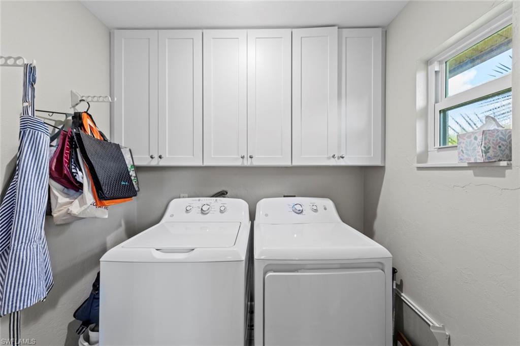 843 Palm View Drive, Unit 25 Naples, FL 34110 - Photo 16 of 27 a view of storage and utility room with washer and dryer