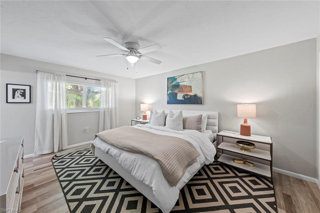 843 Palm View Drive, Unit 25 Naples, FL 34110 - Photo 17 of 27 a bedroom with a bed and a window