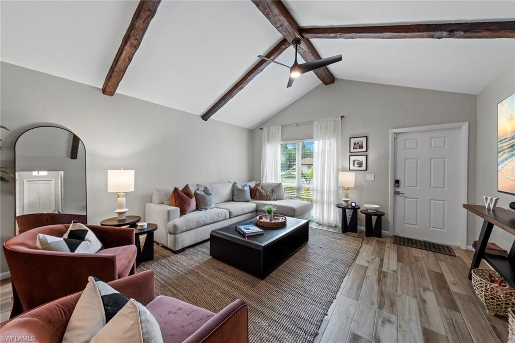 843 Palm View Drive, Unit 25 Naples, FL 34110 - Photo 7 of 27 a living room with furniture and wooden floor