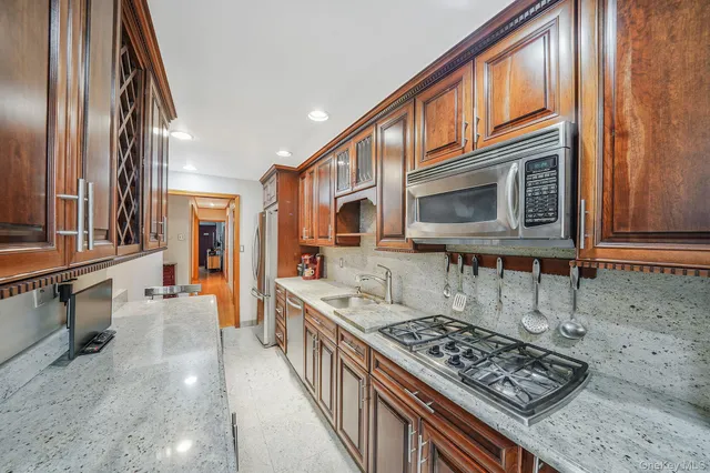 a bathroom with a toilet a sink and a mirror