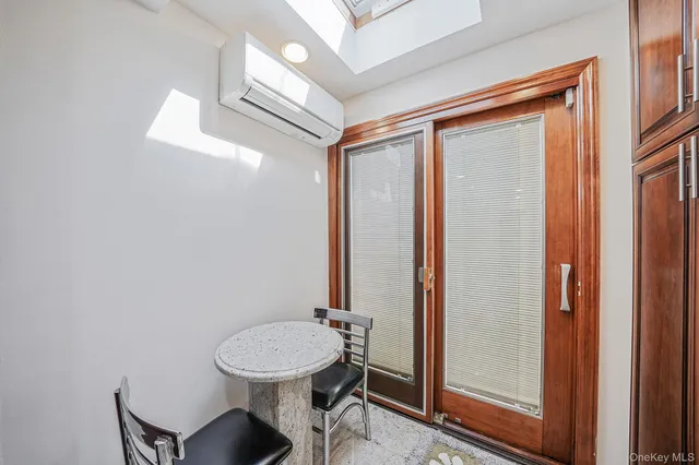 a view of a hallway with furniture