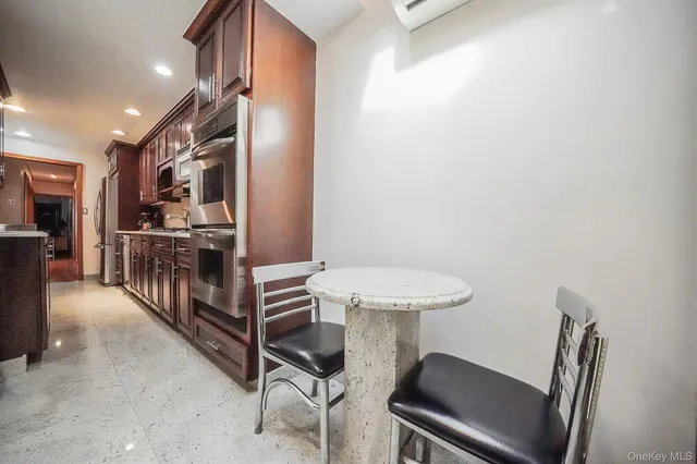 a bedroom with a bed and a flat tv screen on wall