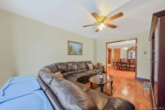 a dining room with furniture window and wooden floor