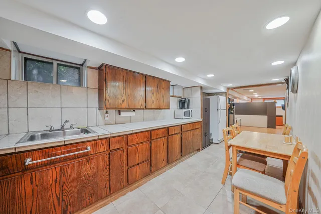 an empty room with a projector and windows