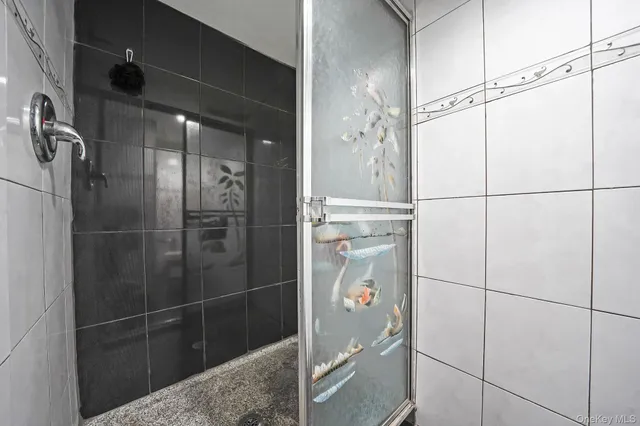 a utility room with dryer washer and a window