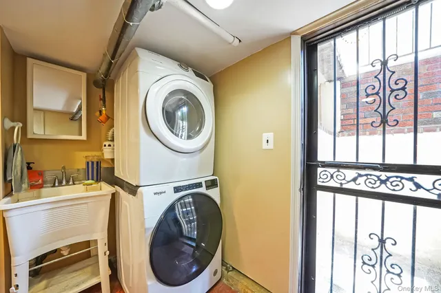 a view of a hallway with a door and wooden floor