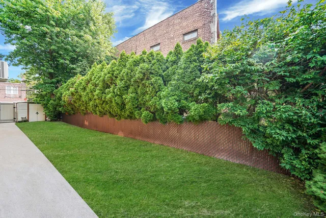 a view of yard with green space and seating area