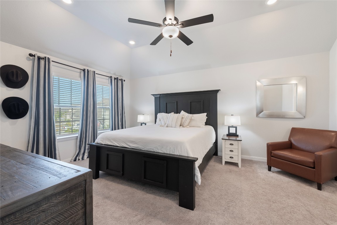 261 Fawn Riv Run Kyle, TX 78640 - Photo 19 of 40 a bed room with a bed and a television