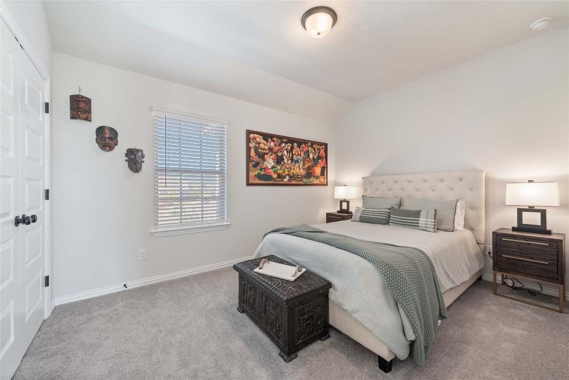 261 Fawn Riv Run Kyle, TX 78640 - Photo 24 of 40 a bedroom with a bed and a window