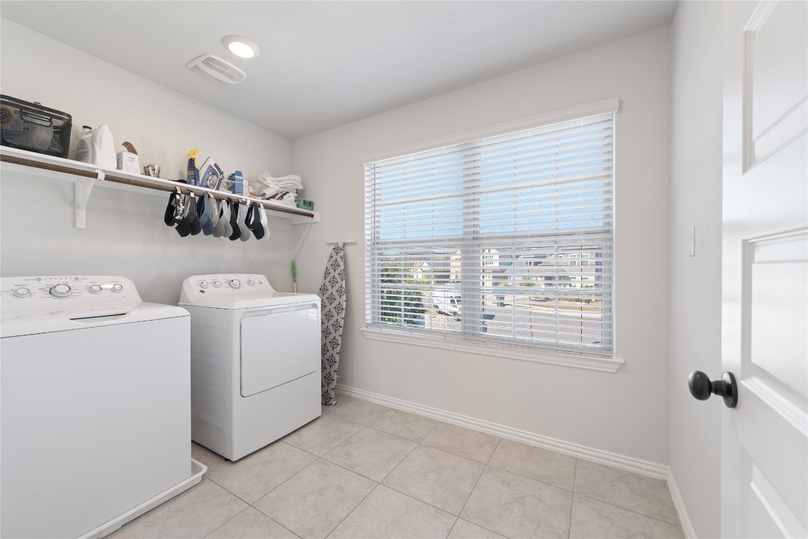261 Fawn Riv Run Kyle, TX 78640 - Photo 27 of 40 a view of storage and utility room with washer and dryer
