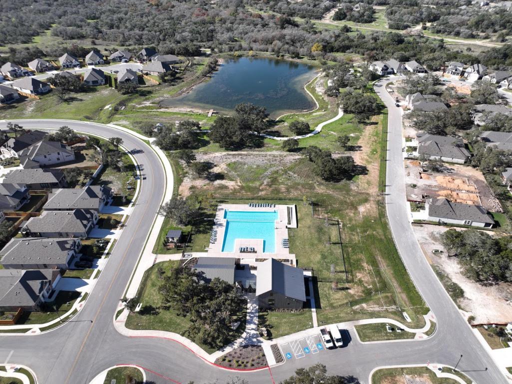 261 Fawn Riv Run Kyle, TX 78640 - Photo 36 of 40 an aerial view of residential houses with outdoor space