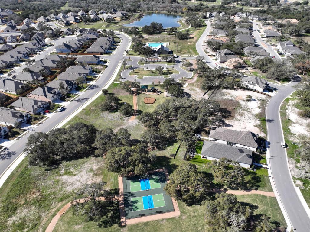 261 Fawn Riv Run Kyle, TX 78640 - Photo 37 of 40 an aerial view of residential houses with outdoor space