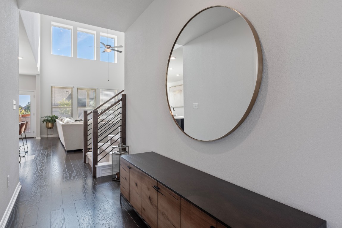 261 Fawn Riv Run Kyle, TX 78640 - Photo 5 of 40 a view of a livingroom with furniture and wooden floor