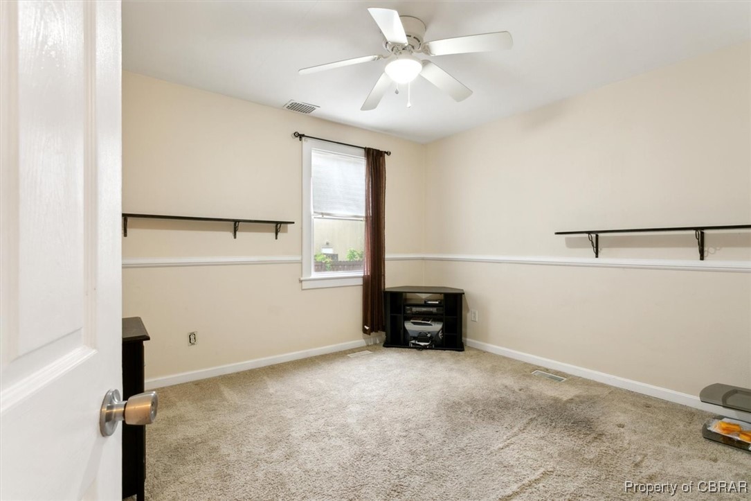 345 Fox Hill Road Hampton, VA 23669 - Photo 15 of 46 Carpeted spare room featuring visible vents, baseboards, and ceiling fan