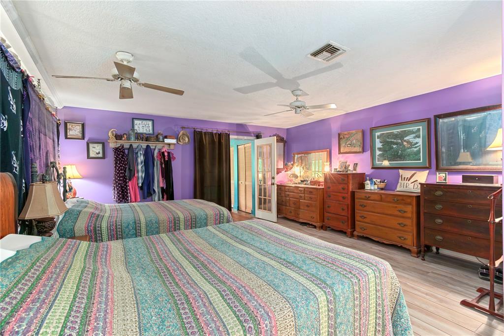 17840 Northeast 45th Avenue Road Citra, FL 32113 - Photo 19 of 62 a bed room with a bed and a dresser