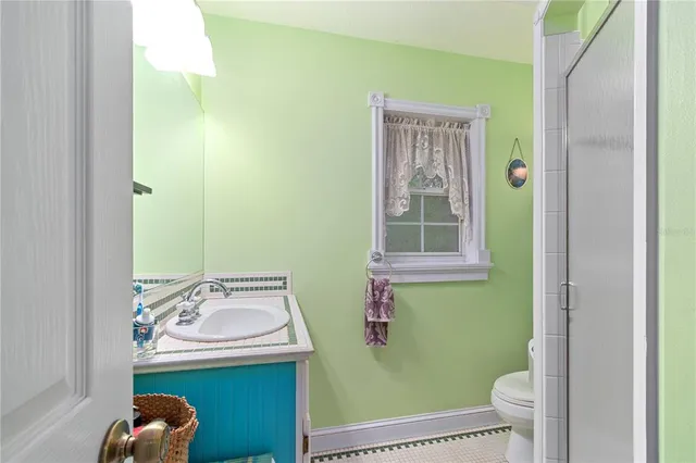 a kitchen with stainless steel appliances a refrigerator a sink and a stove