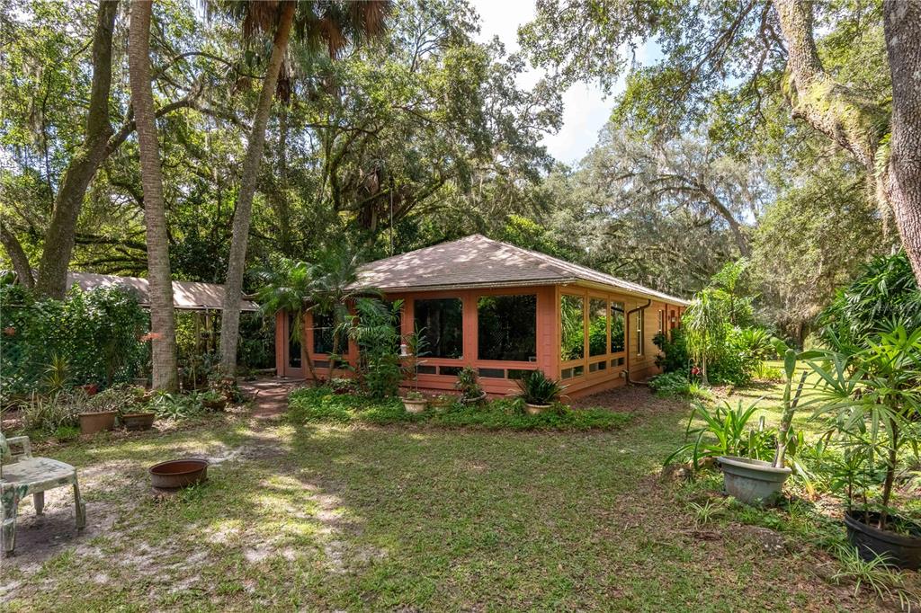 17840 Northeast 45th Avenue Road Citra, FL 32113 - Photo 2 of 62 a front view of a house with garden