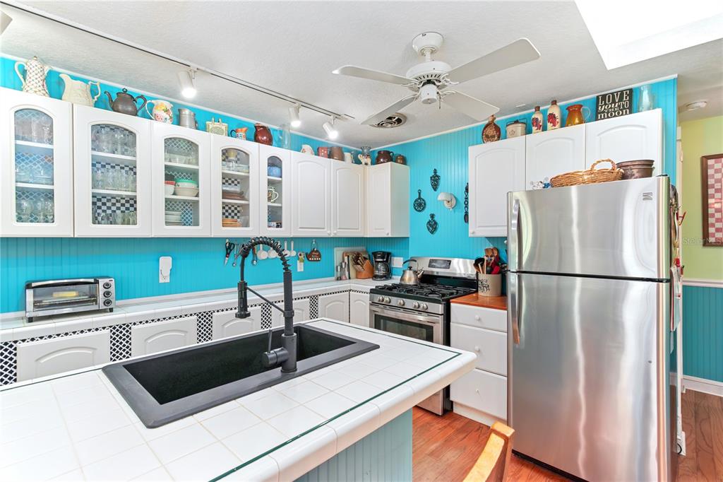17840 Northeast 45th Avenue Road Citra, FL 32113 - Photo 23 of 62 a kitchen with stainless steel appliances a refrigerator a sink and a stove