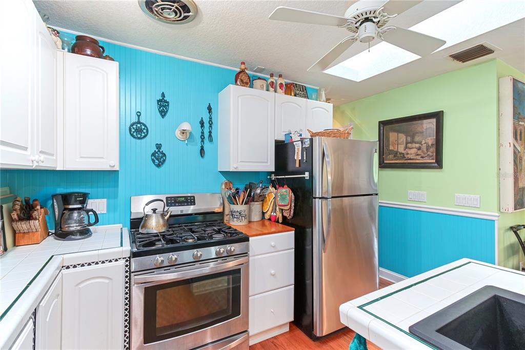 17840 Northeast 45th Avenue Road Citra, FL 32113 - Photo 25 of 62 a kitchen with a refrigerator and a sink