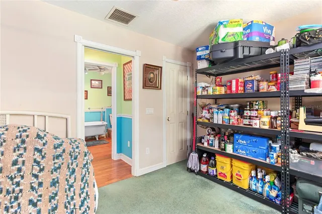 a view of a yard with large trees