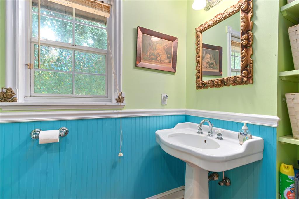 17840 Northeast 45th Avenue Road Citra, FL 32113 - Photo 32 of 62 a bathroom with a sink and a mirror