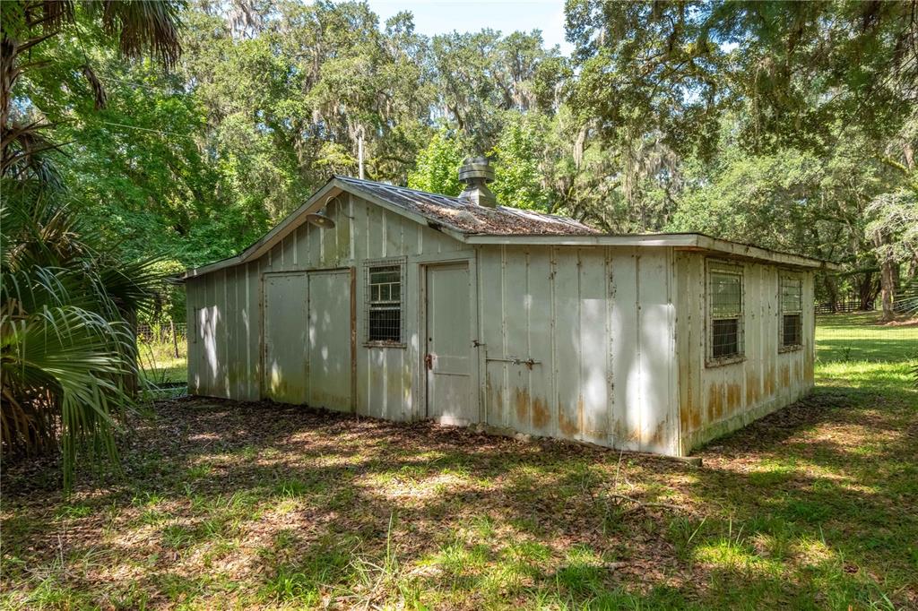 17840 Northeast 45th Avenue Road Citra, FL 32113 - Photo 40 of 62 a backyard of a house with lots of green space