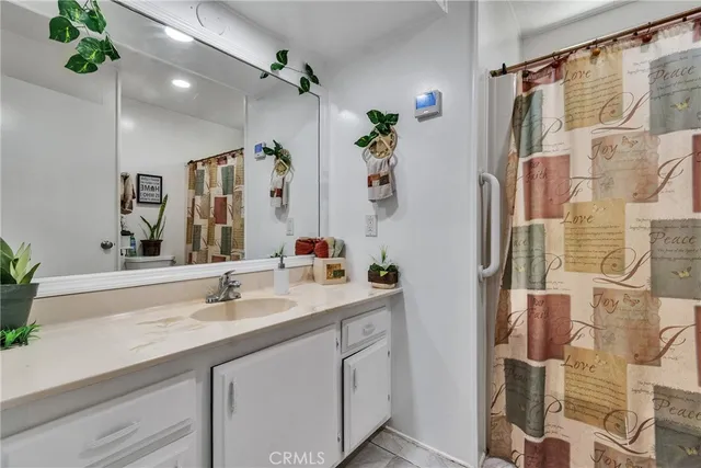a patio with a table and chairs under an umbrella