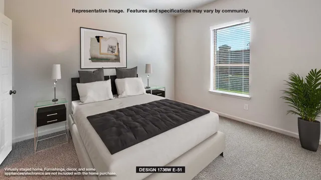 a bedroom with a bed lamp and a potted plant