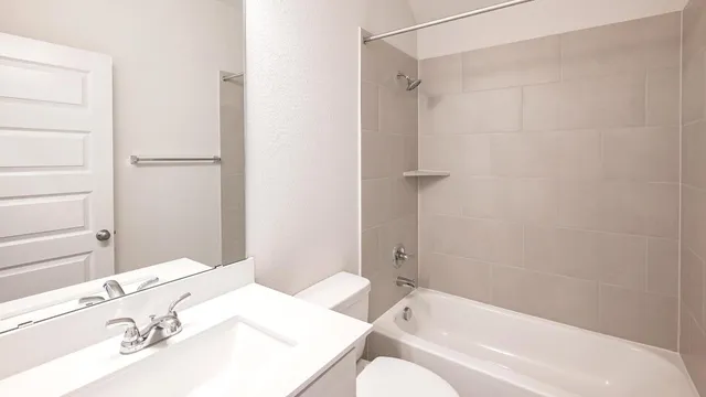a bathroom with a bathtub and a sink
