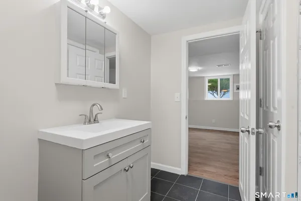 a bathroom with a sink and a mirror