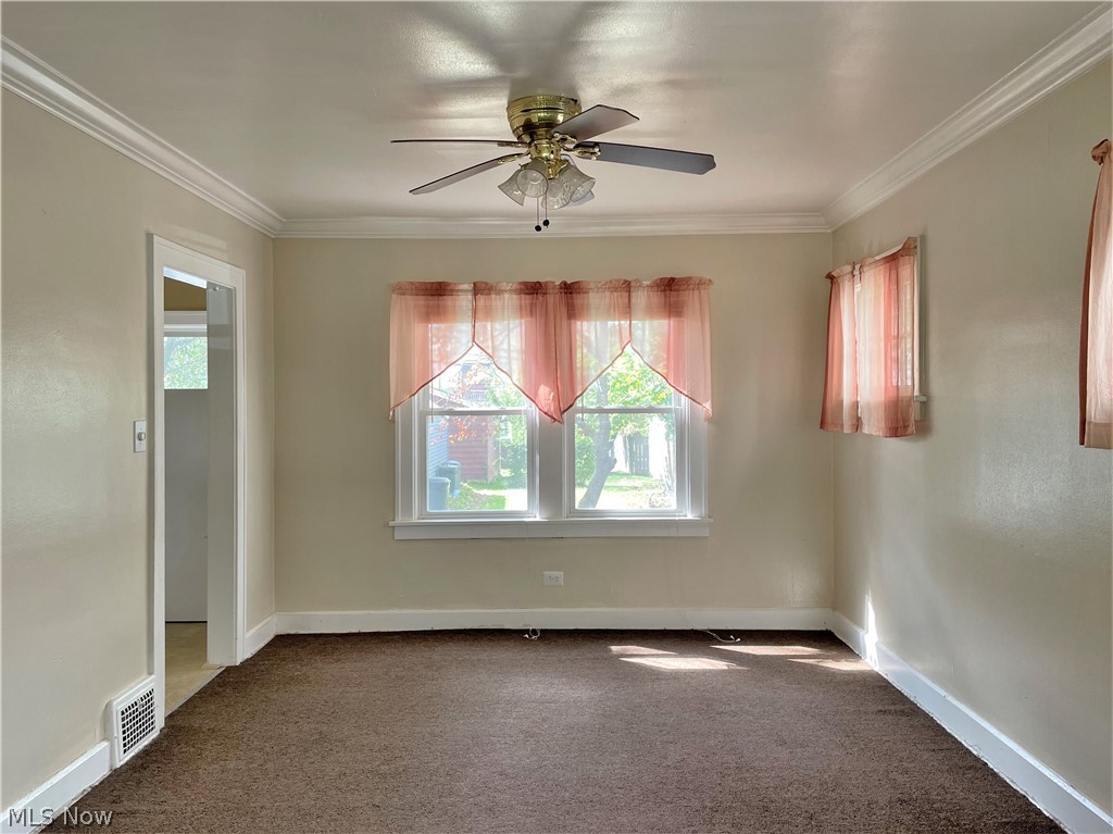 2104 Rossmoor Road Cleveland Heights, OH 44118 - Photo 4 of 35 Formal Dining Room adorned with crown molding.