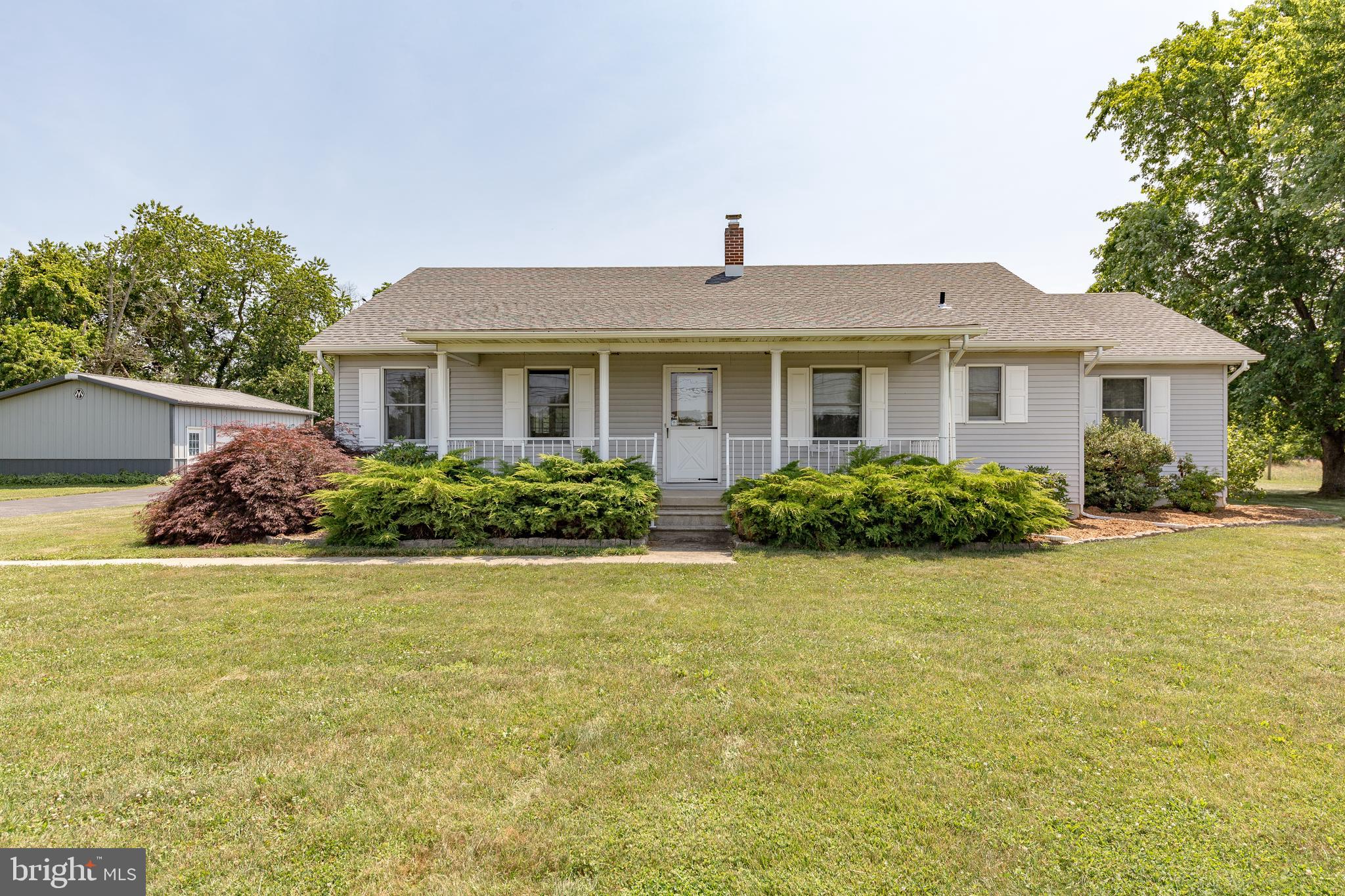 1250 Centerton Road Elmer, NJ 08318 - Photo 1 of 23 a front view of a house with garden