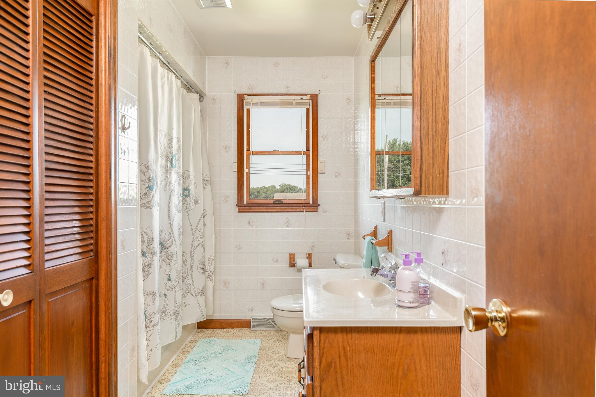 1250 Centerton Road Elmer, NJ 08318 - Photo 14 of 23 a bathroom with a granite countertop sink and a mirror