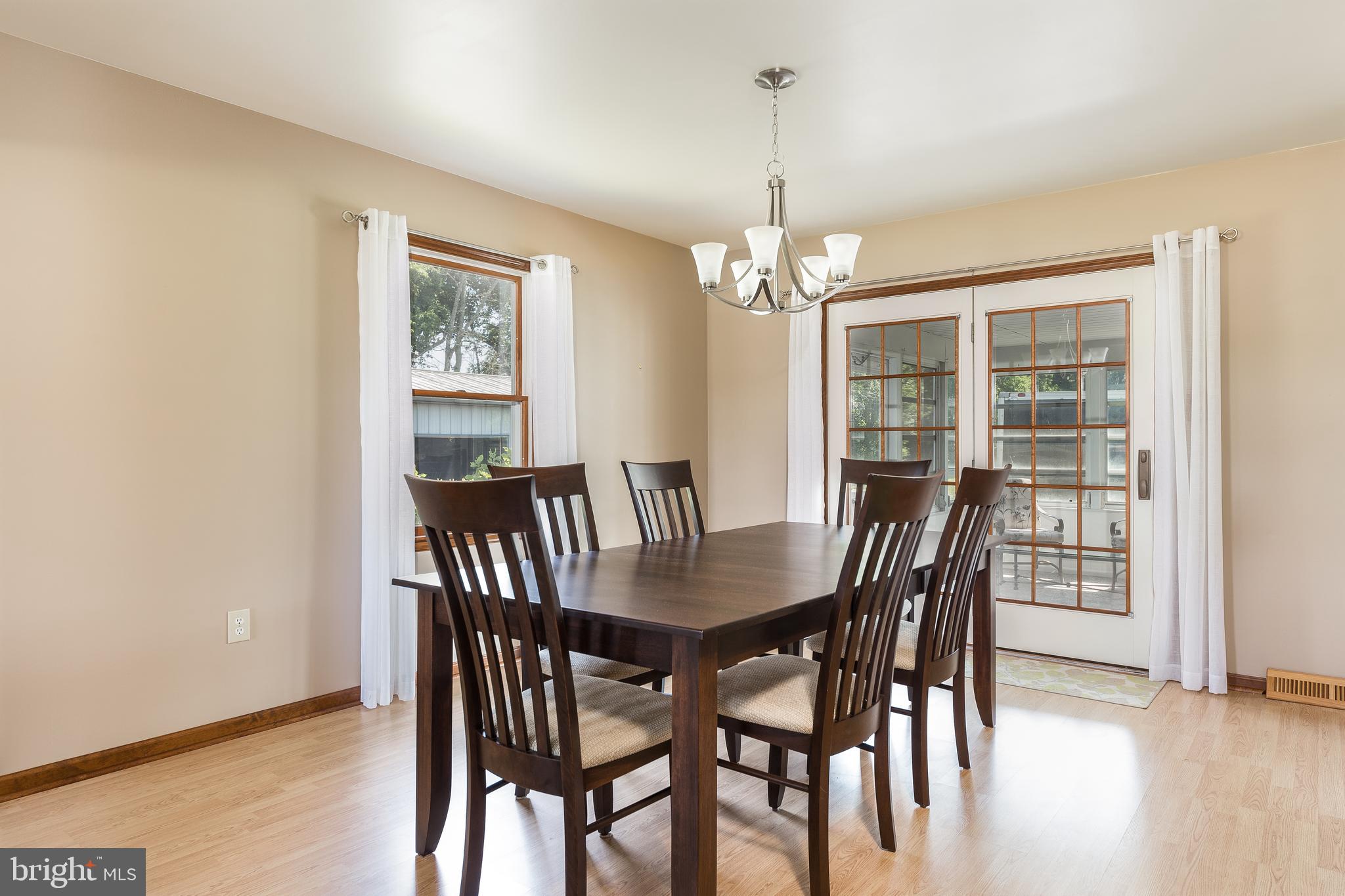 1250 Centerton Road Elmer, NJ 08318 - Photo 4 of 23 a view of a dining room with furniture window and wooden floor