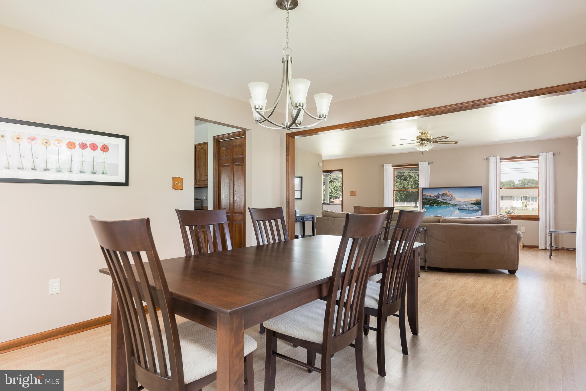 1250 Centerton Road Elmer, NJ 08318 - Photo 5 of 23 a view of a dining room with furniture and wooden floor