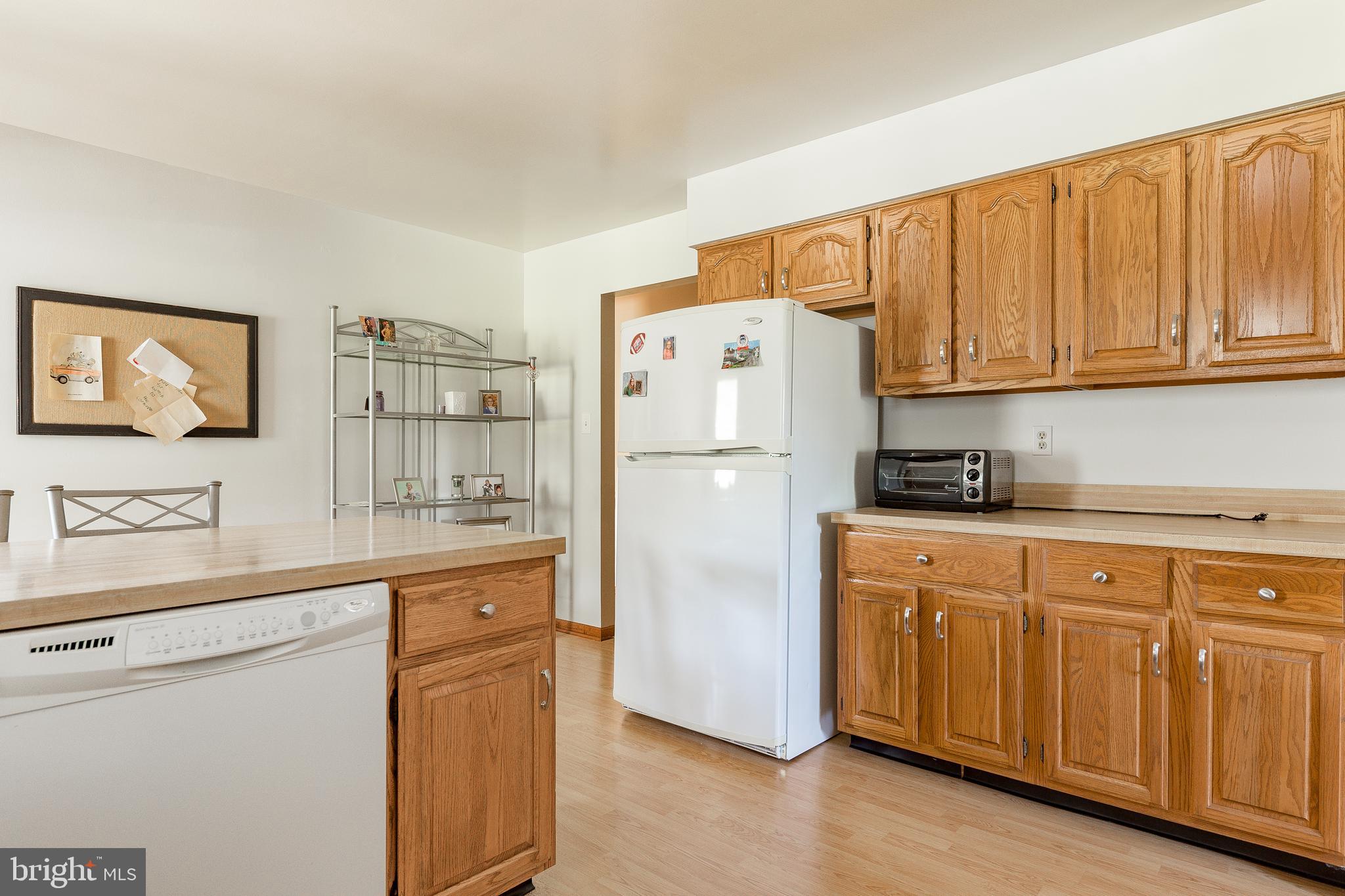 1250 Centerton Road Elmer, NJ 08318 - Photo 8 of 23 a white refrigerator freezer sitting in a kitchen