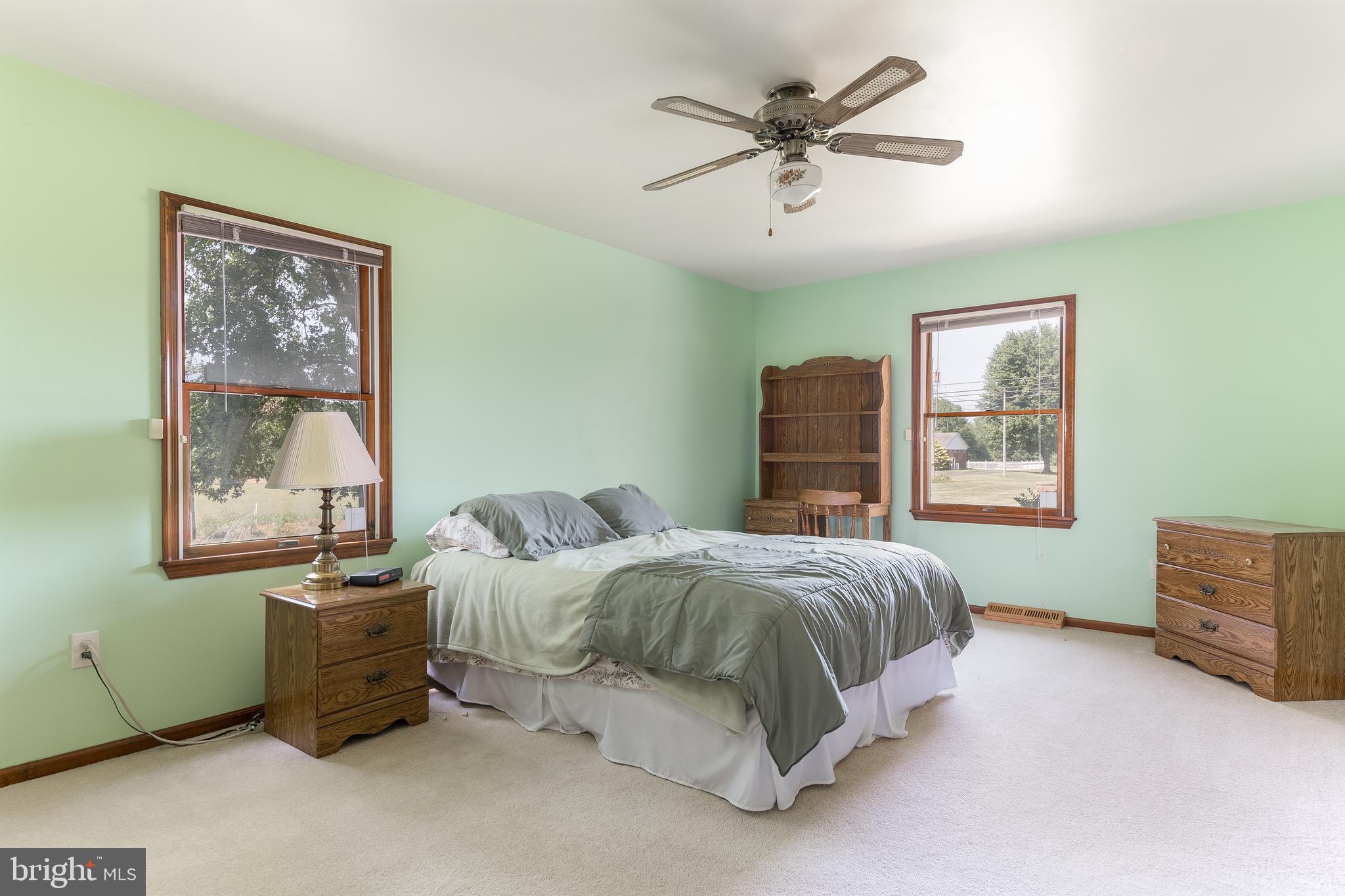 1250 Centerton Road Elmer, NJ 08318 - Photo 9 of 23 a bedroom with a bed and a window