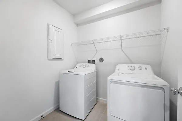 a utility room with dryer and washer
