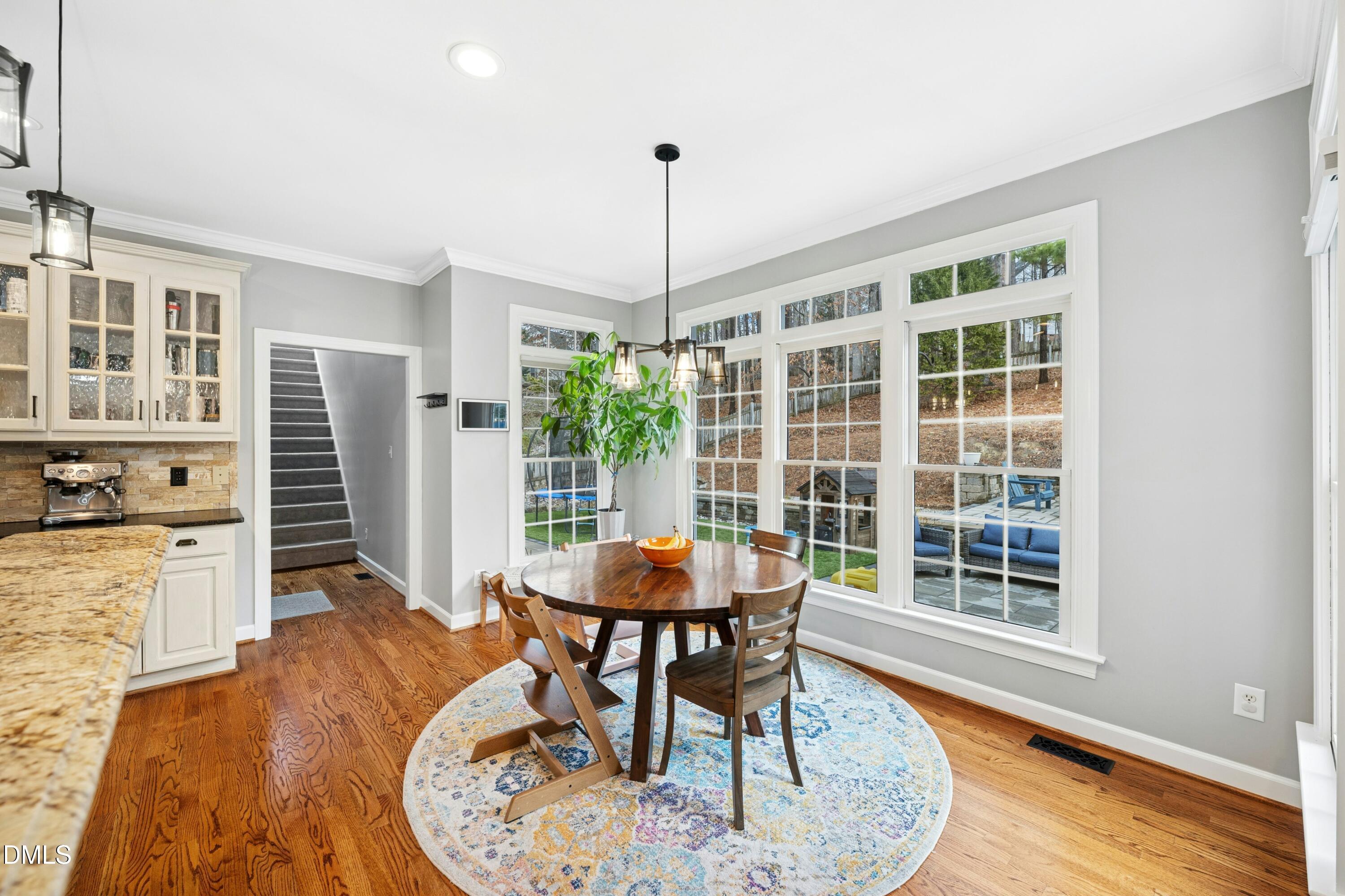 117 Barnes Spring Court Cary, NC 27519 - Photo 14 of 38 a dining room with furniture and wooden floor