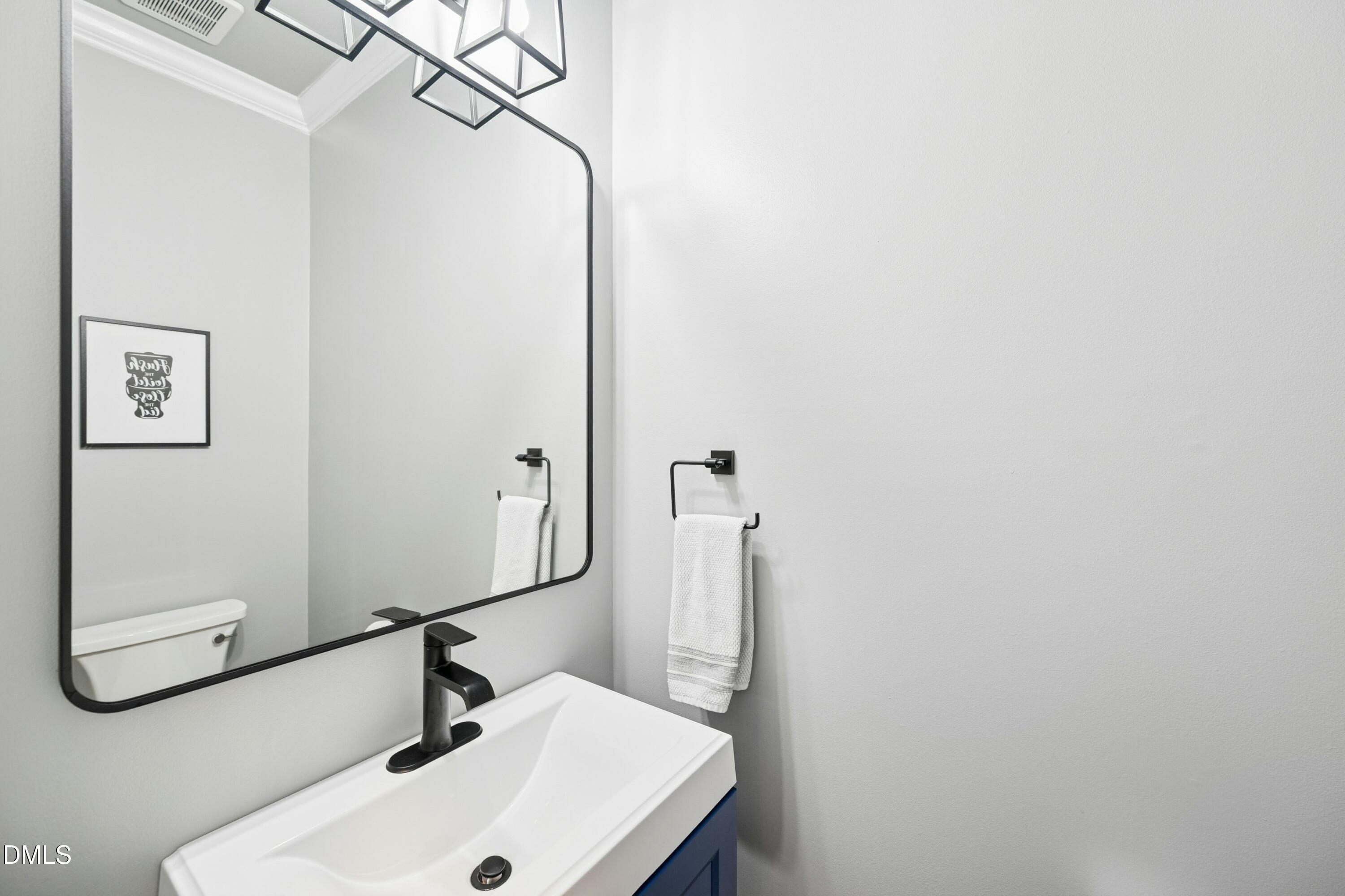 117 Barnes Spring Court Cary, NC 27519 - Photo 15 of 38 a bathroom with a sink and a mirror