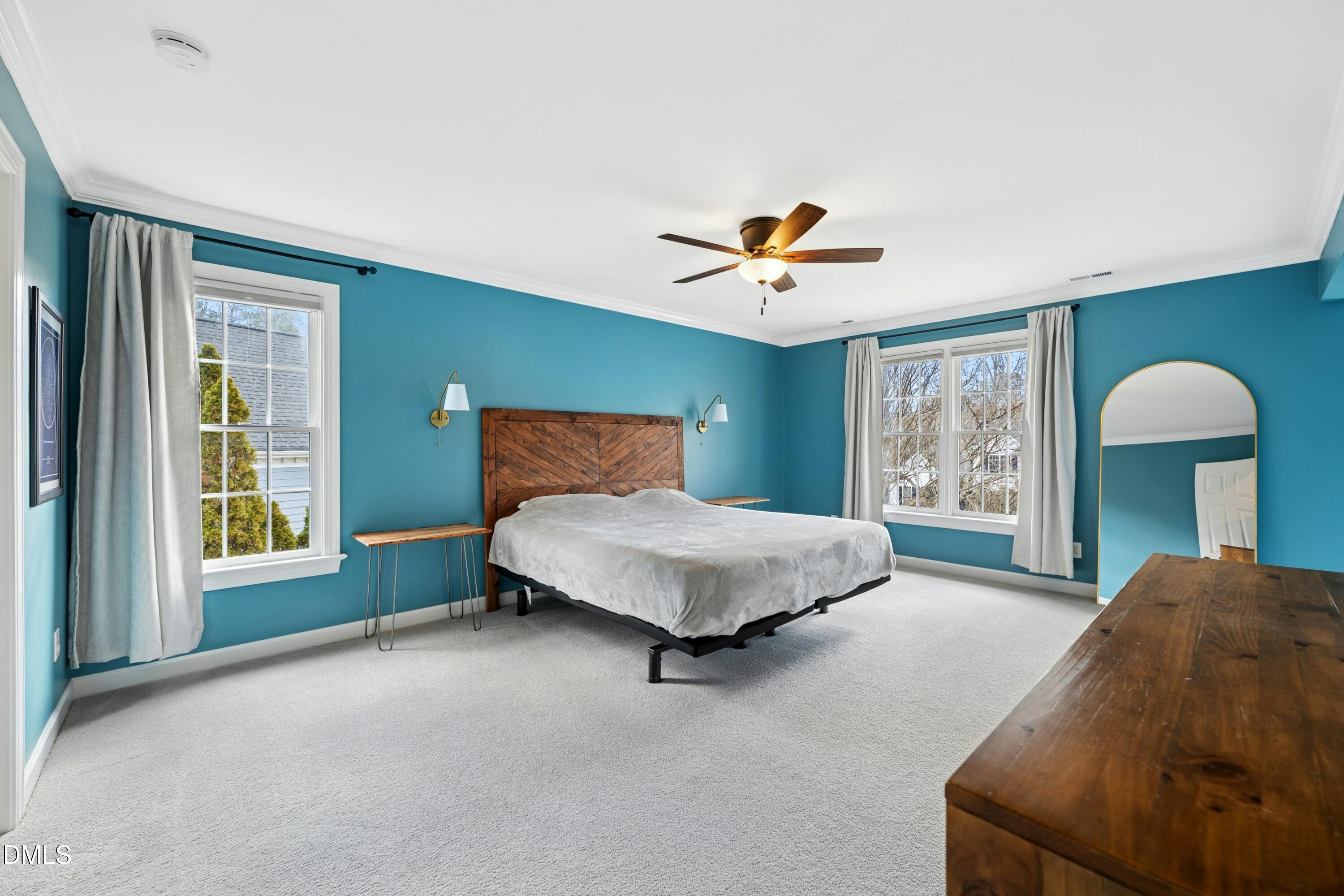 117 Barnes Spring Court Cary, NC 27519 - Photo 16 of 38 a bedroom with a bed and a lamp on table