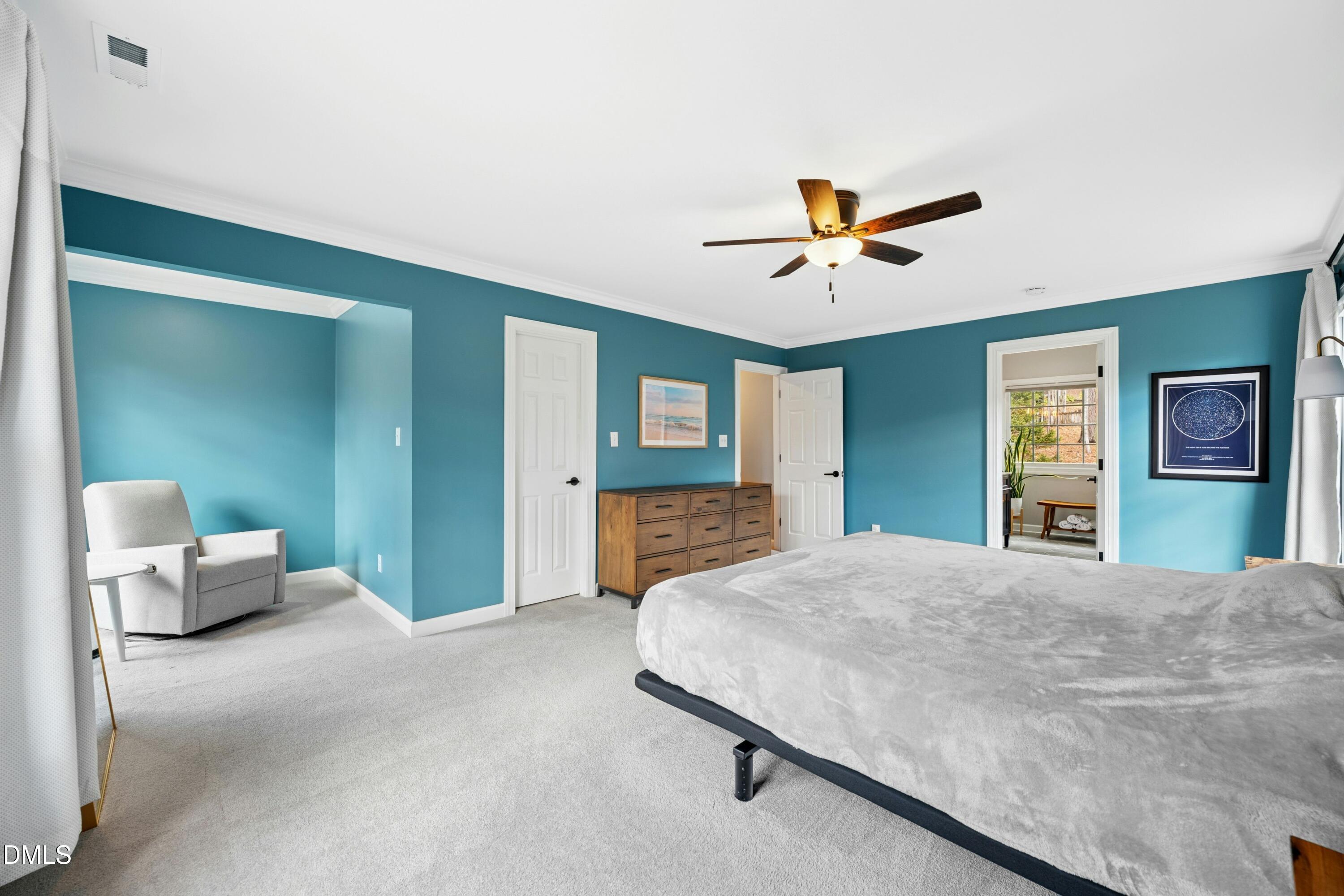117 Barnes Spring Court Cary, NC 27519 - Photo 18 of 38 a bedroom with a bed and a chandelier