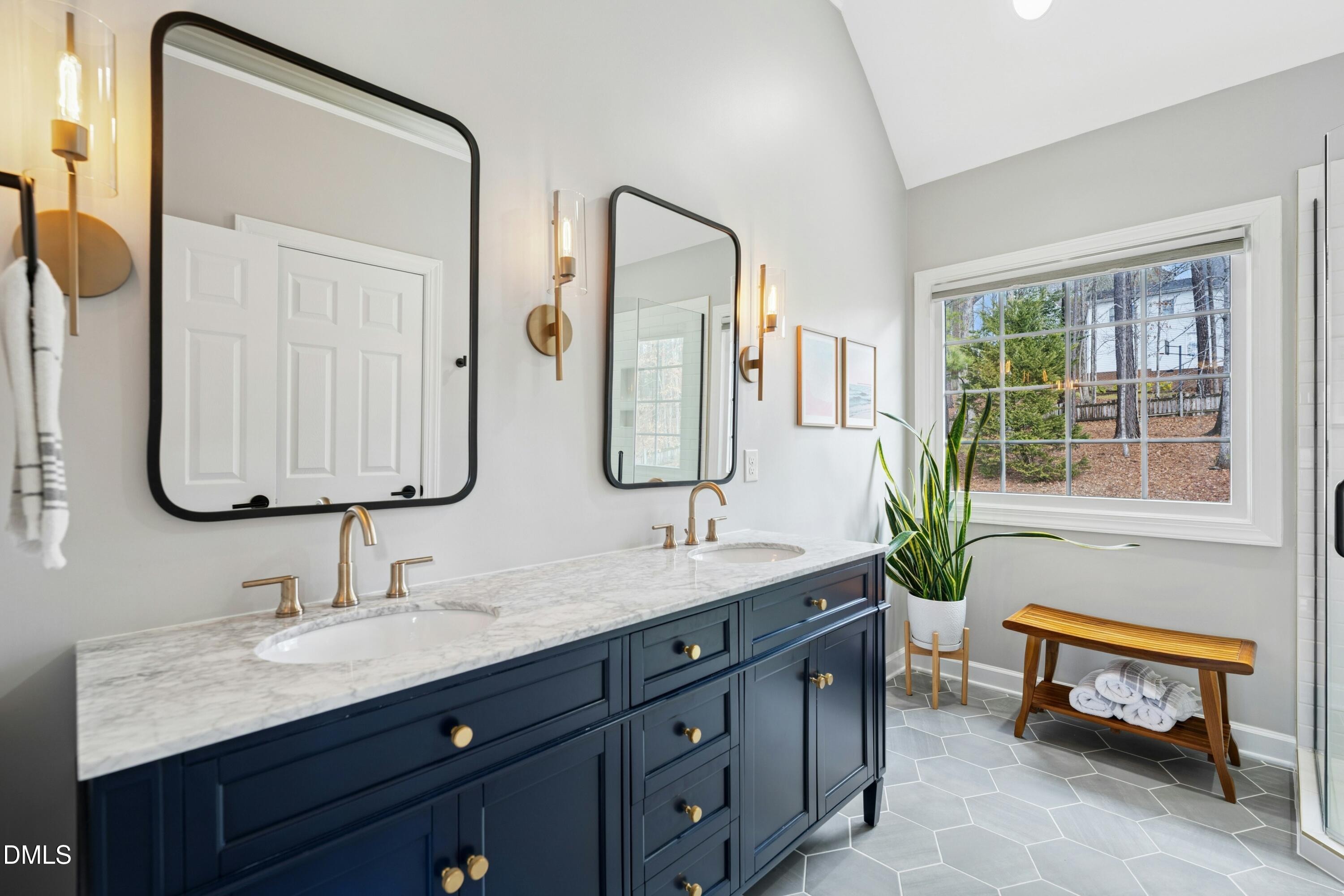 117 Barnes Spring Court Cary, NC 27519 - Photo 20 of 38 a bathroom with a double vanity sink mirror and bathtub