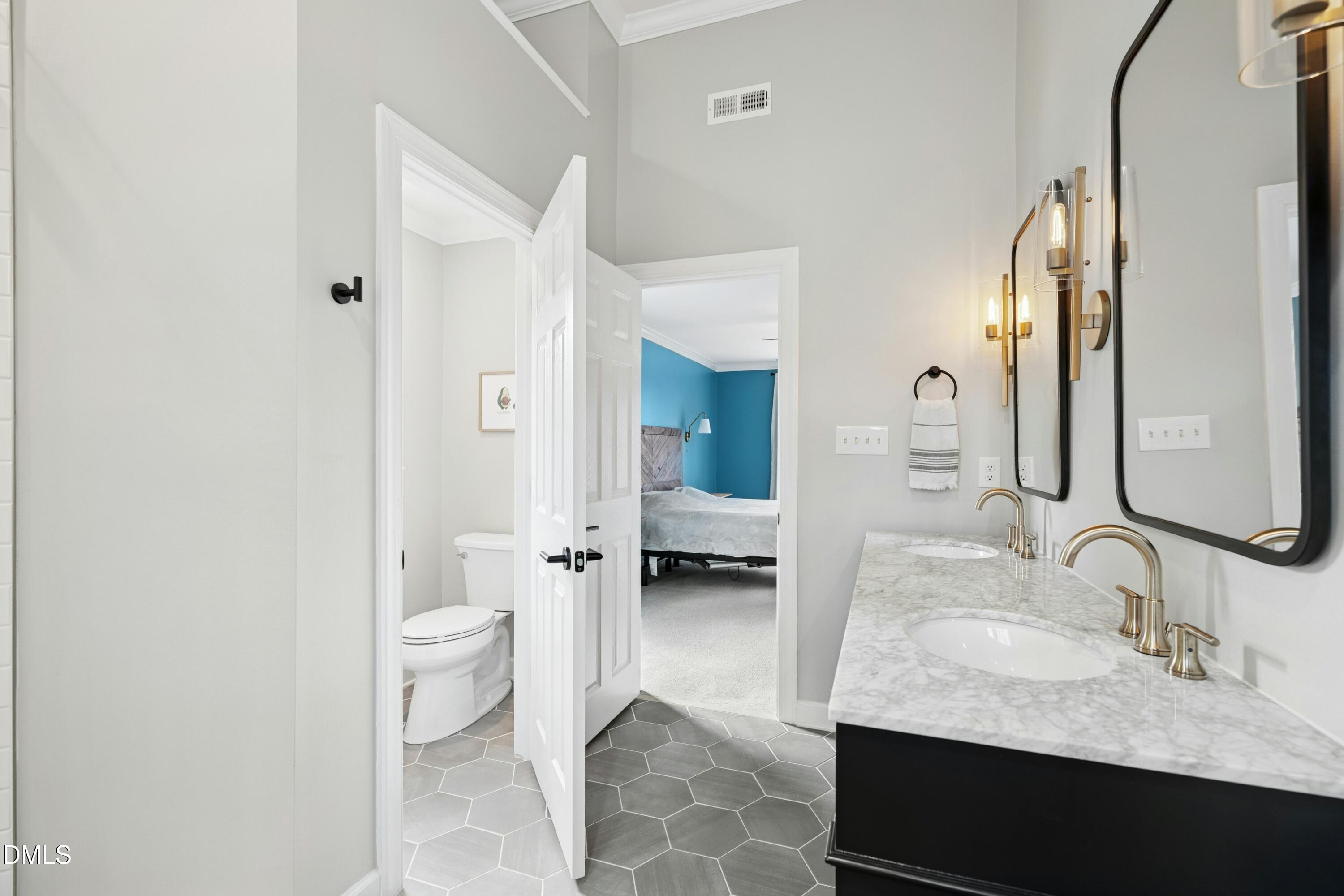 117 Barnes Spring Court Cary, NC 27519 - Photo 22 of 38 a bathroom with a granite countertop sink and a mirror