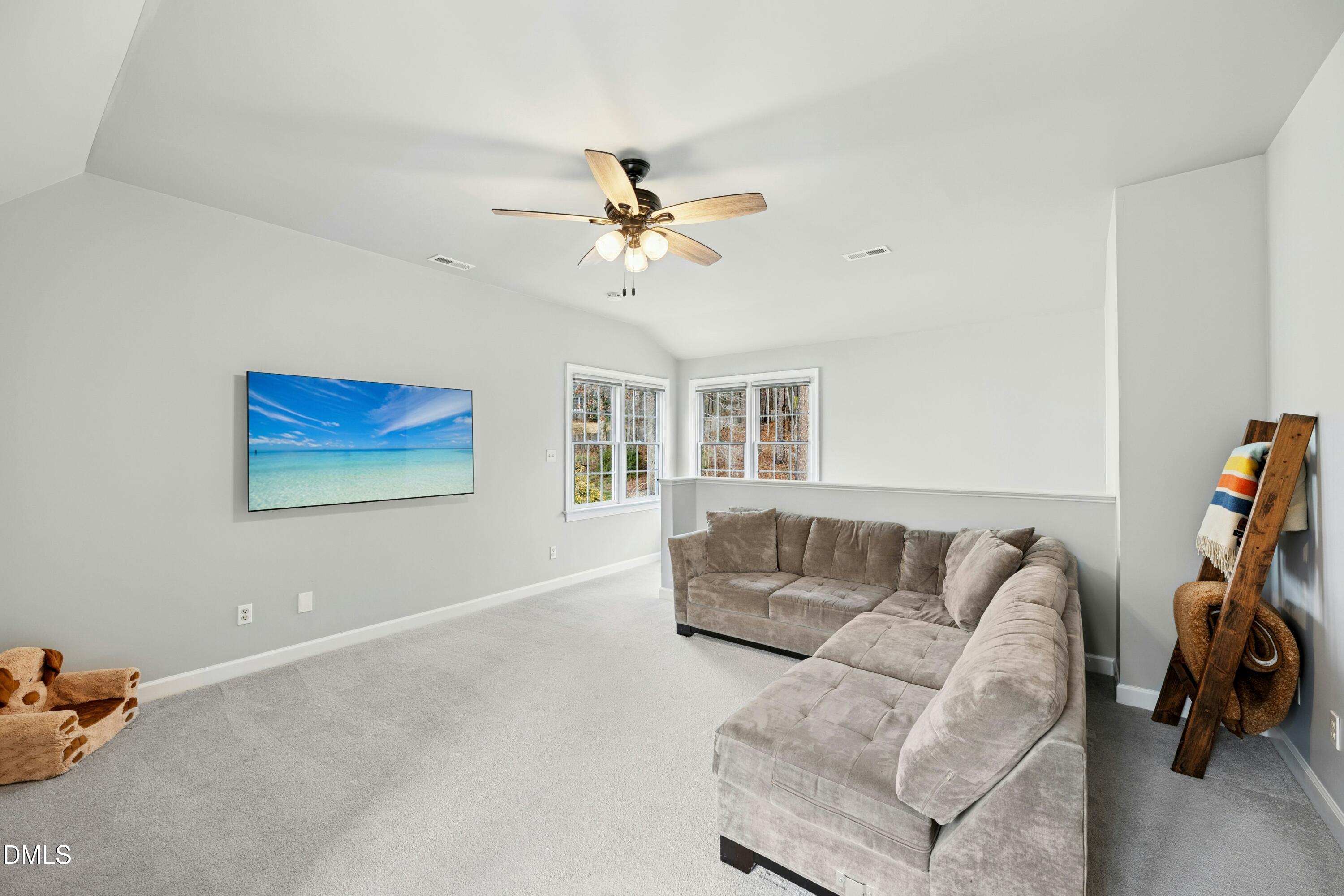 117 Barnes Spring Court Cary, NC 27519 - Photo 25 of 38 a living room with furniture and a couch
