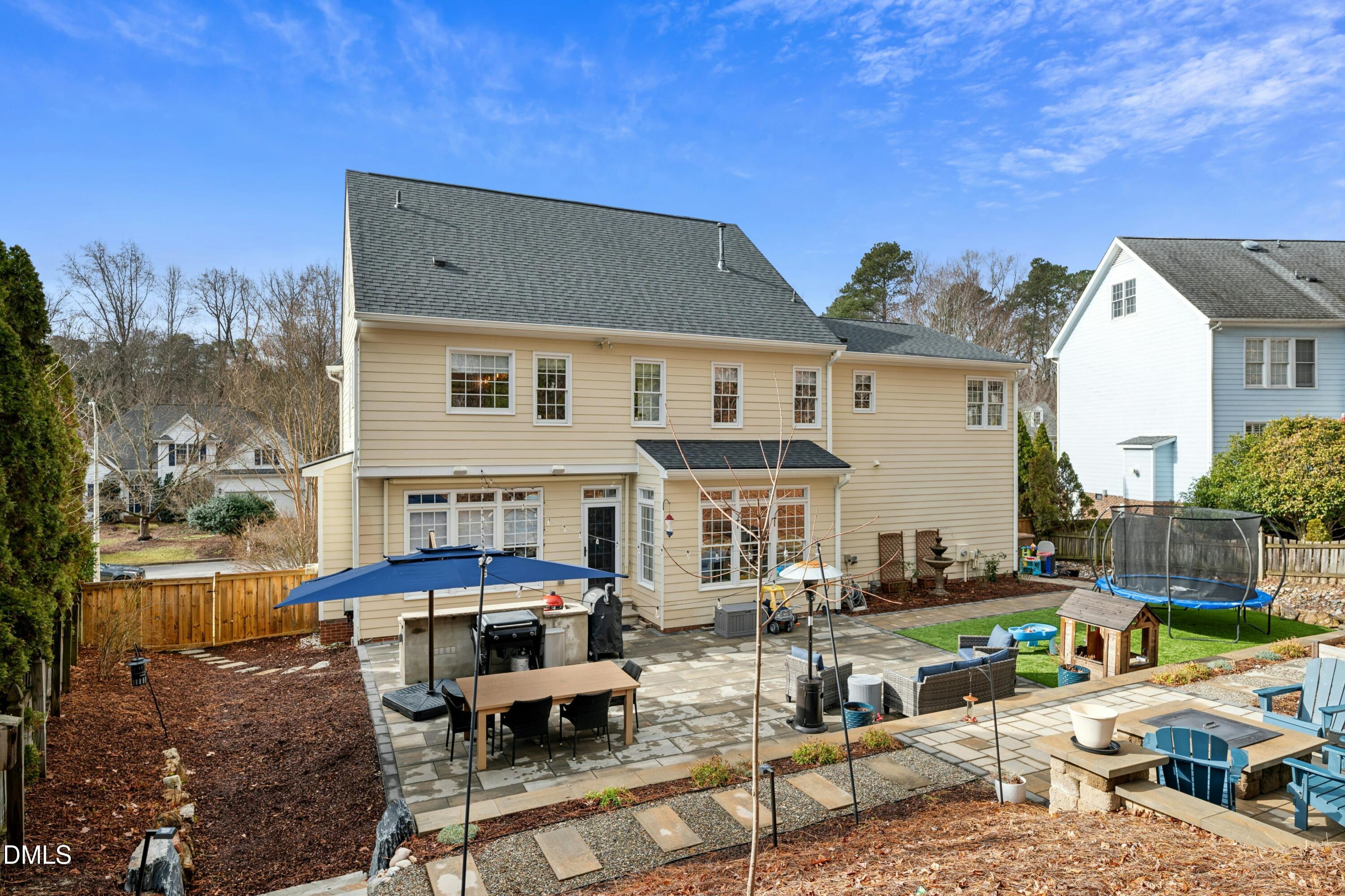 117 Barnes Spring Court Cary, NC 27519 - Photo 36 of 38 a view of a patio with chairs and a table