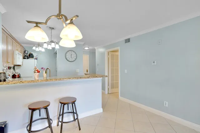 a view of a dining room and kitchen