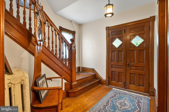 a livingroom with furniture staircase and a rug