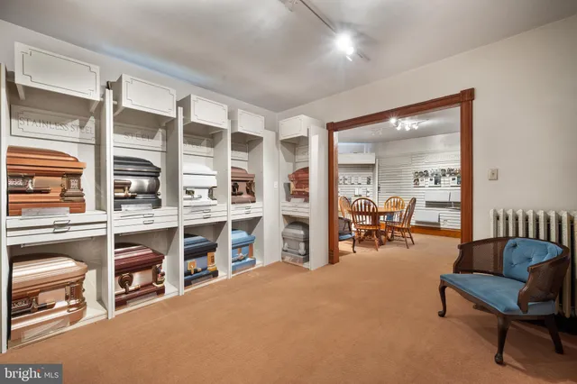 a view of a livingroom with furniture and a window