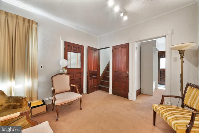 a view of a room with wooden floor and windows